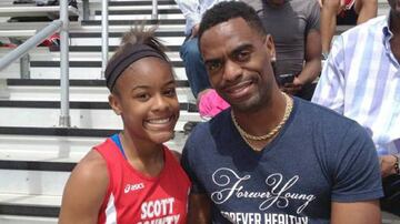 Tyson Gay (right) with daughter Trinity.
