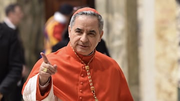 (FILES) In this file photo taken on June 28, 2018 Newly elevated cardinal, Giovanni Angelo Becciu from Italy, attends the courtesy visit of relatives following a consistory for the creation of new cardinals on June 28, 2018 in the Apostolic Palace at St Peter's basilica in Vatican. - Cardinal Angelo Becciu, the head of the vatican's saint-making office, resigned, the Vatican said in a statement on September 24, 2020. Becciu was reportedly indirectly implicated in a financial scandal involving the Vatican’s investment in a London real estate deal. (Photo by ANDREAS SOLARO / AFP)