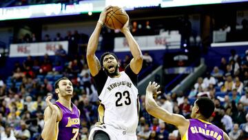 Nov 29, 2016; New Orleans, LA, USA; New Orleans Pelicans forward Anthony Davis (23) drives between Los Angeles Lakers forward Larry Nance Jr. (7) and guard Jordan Clarkson (6) during the second half of a game at the Smoothie King Center. The Pelicans defeated the Lakers 105-88. Mandatory Credit: Derick E. Hingle-USA TODAY Sports