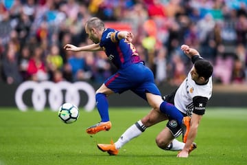 Still got it | Goncalo Guedes of Valencia CF tries to tackle Andres Iniesta of FC Barcelona.