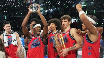 Team Vince guard VJ Edgecombe (77) of the Philadelphia 76ers reacts with the MVP trophy after defeating Team Melo during an NBA All Star Rising Stars championship game at Intuit Dome.