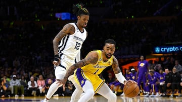 Apr 28, 2023; Los Angeles, California, USA; Los Angeles Lakers guard D'Angelo Russell (1) dribbles against Memphis Grizzlies guard Ja Morant (12) in the first quarter of game six of the 2023 NBA playoffs at Crypto.com Arena. Mandatory Credit: Jayne Kamin-Oncea-USA TODAY Sports