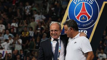 Luis Campos (L), Portuguese Football Advisor for French club Paris Saint-Germain, celebrates with Paris Saint-Germain's French head coach Christophe Galtier after the team won the French Champions' Trophy (Trophee des Champions) final football match, Paris Saint-Germain versus FC Nantes, in the at the Bloomfield Stadium, in Tel Aviv on July 31, 2022. - Paris Saint-Germain (PSG) beat Nantes 4-0 to clinch the trophy. (Photo by JACK GUEZ / AFP)