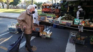 A customer walks outside a shop at a greengrocery store in a street market, in Buenos Aires, Argentina June 15, 2021. Picture taken June 15, 2021. REUTERS/Agustin Marcarian