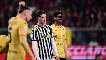 Juventus' Serbian forward #09 Dusan Vlahovic (C) stands next to Genoa's Belgian defender #04 Koni De Winter during the Italian Serie A football match between Genoa and Juventus at the Luigi Ferraris stadium, on December 15, 2023. (Photo by Marco BERTORELLO / AFP)