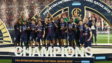 Soccer Football - FIFA Intercontinental Cup - Final - Paris St Germain v Flamengo - Ahmad Bin Ali Stadium, Al-Rayyan, Qatar - December 17, 2025 Paris St Germain's Marquinhos lifts the trophy with teammates after winning the FIFA Intercontinental cup final REUTERS/Mohammed Salem