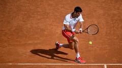 Serbia&#039;s Novak Djokovic returns a backhand to Spain&#039;s Alejandro Davidovich during their match of the Men&#039;s Italian Open at Foro Italico on May 13, 2021 in Rome, Italy. (Photo by Filippo MONTEFORTE / AFP)