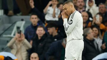 Real Madrid's French forward #09 Kylian Mbappe celebrates scoring the opening goal during the Spanish league football match between Real Madrid CF and Sevilla FC at the Santiago Bernabeu stadium in Madrid on December 22, 2024. (Photo by OSCAR DEL POZO / AFP)