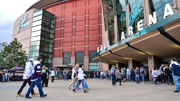 Fans approach the main entrance gate outside the arena