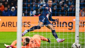 Paris Saint-Germain's French forward Kylian Mbappe scores his team's third goal during the French L1 football match between Olympique Marseille (OM) and Paris Saint-Germain (PSG) at the Velodrome stadium in Marseille, southern France on February 26, 2023. (Photo by Christophe SIMON / AFP)