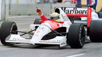 (FILES) In this file photograph taken on March 10, 1991, Brazilian F1 driver and current world champion Ayrton Senna waves to the crowd after winning the 1991 edition of the US Grand Prix in Phoenix. - Yellow with green and blue stripes, Ayrton Senna&#039