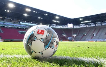 A football sits on the pitch prior to the  German first division Bundesliga football match FC Augsburg v VfL Wolfsburg on May 16, 2020 in Augsburg, southern Germany, as the season resumed following a two-month absence due to the novel coronavirus COVID-19