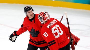 Milano Cortina 2026 Olympics - Ice Hockey - Men's Play-offs Semifinals - Canada vs Finland - Milano Santagiulia Ice Hockey Arena, Milan, Italy - February 20, 2026. Mitch Marner of Canada and Jordan Binnington of Canada celebrate after the match REUTERS/David W Cerny