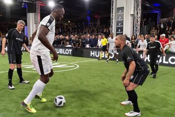 Usain Bolt faces up against Roberto Carlos.