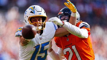 Oct 13, 2024; Denver, Colorado, USA; Denver Broncos cornerback Riley Moss (21) breaks up a pass to Los Angeles Chargers wide receiver Ladd McConkey (15) in the second half at Empower Field at Mile High. Mandatory Credit: Ron Chenoy-Imagn Images TPX IMAGES OF THE DAY