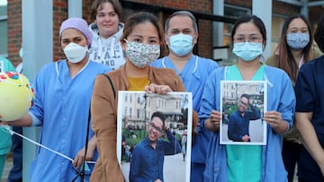 LONDON, ENGLAND  - APRIL 30: Medical workers take part in &#039;Clap for Our Carers&#039; outside Kingston Hospital on April 30, 2020 in London, England United Kingdom. Following the success of  the &quot;Clap for Our Carers&quot; campaign, members of the