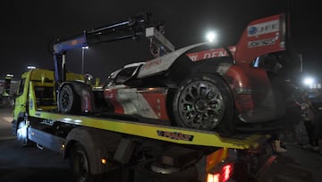 Toyota GR010 Hybrid Hypercar WEC Japanese driver Kamui Kobayashi's wrecked car is carried back to its pit by a tow truck after the crash that forced the N�7 Toyota to retire, during the 100th edition of the 24 Hours of Le Mans, on June 11, 2023. (Photo by JEAN-FRANCOIS MONIER / AFP)