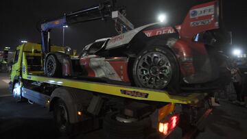 Toyota GR010 Hybrid Hypercar WEC Japanese driver Kamui Kobayashi's wrecked car is carried back to its pit by a tow truck after the crash that forced the N�7 Toyota to retire, during the 100th edition of the 24 Hours of Le Mans, on June 11, 2023. (Photo by JEAN-FRANCOIS MONIER / AFP)