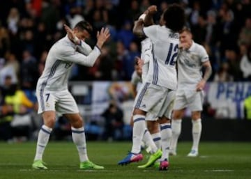 Football Soccer - Real Madrid v Real Betis - Spanish La Liga Santander - Santiago Bernabéu stadium, Madrid, Spain, 12/03/17 Real Madrid's Cristiano Ronaldo (L) celebrates with team mate Marcelo after scoring a goal. REUTERS/Sergio Perez