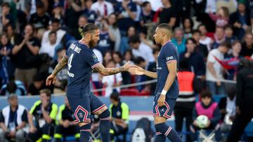 PARIS, FRANCE - MAY 21: Kylian Mbappe of PSG celebrates his first goal with Sergio Ramos (left) during the Ligue 1 Uber Eats match between Paris Saint-Germain (PSG) and FC Metz at Parc des Princes stadium on May 21, 2022 in Paris, France. (Photo by John Berry/Getty Images)