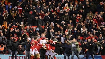 NOTTINGHAM, ENGLAND - JANUARY 09: Lewis Grabban of Nottingham Forest celebrates with teammates and fans after scoring their side&#039;s first goal  during the Emirates FA Cup Third Round match between Nottingham Forest and Arsenal at City Ground on January 09, 2022 in Nottingham, England. (Photo by Michael Regan/Getty Images)