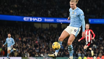 Manchester City's Norwegian striker #09 Erling Haaland controls the ball during the English Premier League football match between Manchester City and Brentford at the Etihad Stadium in Manchester, north west England, on February 20, 2024. (Photo by Paul ELLIS / AFP) / RESTRICTED TO EDITORIAL USE. No use with unauthorized audio, video, data, fixture lists, club/league logos or 'live' services. Online in-match use limited to 120 images. An additional 40 images may be used in extra time. No video emulation. Social media in-match use limited to 120 images. An additional 40 images may be used in extra time. No use in betting publications, games or single club/league/player publications. / 