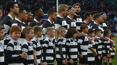 LONDON, ENGLAND - DECEMBER 01: Barbarians Players and Mascots line up for the national anthems prior to the Killick Cup match between Barbarians and Argentina at Twickenham Stadium on December 1, 2018 in London, England. (Photo by Steve Bardens/Getty Images for Barbarians)