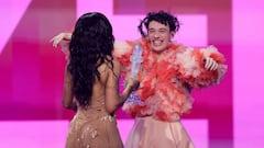 Nemo representing Switzerland reacts while being handed the Eurovision sculpture after winning during the Grand Final of the 2024 Eurovision Song Contest, in Malmo, Sweden, May 11, 2024. REUTERS/Leonhard Foeger