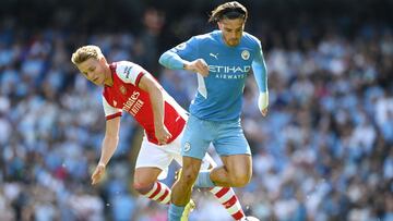 MANCHESTER, ENGLAND - AUGUST 28: Jack Grealish of Manchester City battles for possession with Martin Odegaard of Arsenal  during the Premier League match between Manchester City and Arsenal at Etihad Stadium on August 28, 2021 in Manchester, England. (Pho