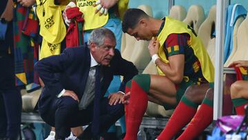 dpatop - 06 December 2022, Qatar, Lusail: Soccer, Qatar 2022 World Cup, Portugal - Switzerland, Round of 16, at Lusail Stadium, Portugal coach Fernando Santos talks to Portugal's Cristiano Ronaldo, who is about to be substituted. Photo: Tom Weller/dpa (Photo by Tom Weller/picture alliance via Getty Images)