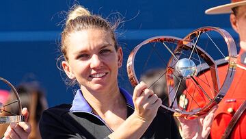 Aug 14, 2022; Toronto, ON, Canada; Simona Halep (ROU) poses with the National Bank Open trophy after defeating Beatriz Haddad Maia (not pictured)  in the women's final of the National Bank Open at Sobeys Stadium. Mandatory Credit: John E. Sokolowski-USA TODAY Sports