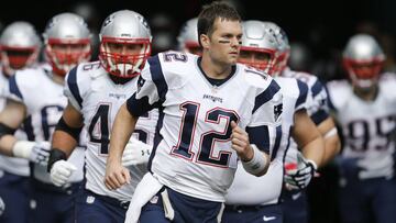 Jan 1, 2017; Miami Gardens, FL, USA; New England Patriots quarterback Tom Brady (12) leads his team out of the tunnel before an NFL football game against the Miami Dolphins at Hard Rock Stadium. The Patriots won 35-14. Mandatory Credit: Reinhold Matay-USA TODAY Sports