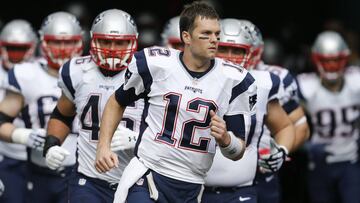 Jan 1, 2017; Miami Gardens, FL, USA;  New England Patriots quarterback Tom Brady (12) leads his team out of the tunnel before an NFL football game against the Miami Dolphins at Hard Rock Stadium. The Patriots won 35-14. Mandatory Credit: Reinhold Matay-USA TODAY Sports