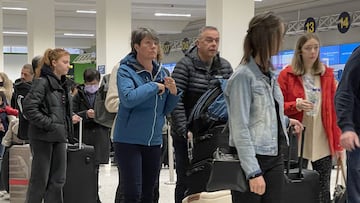 MANCHESTER, UNITED KINGDOM - APRIL 05: Passengers queue for check in at Manchester Airport's terminal 1 on April 05, 2022 in Manchester, United Kingdom. Covid checks, high passenger volumes and staff shortages due to illness have meant longer than usual check-in times at many airports around the UK. (Photo by Christopher Furlong/Getty Images)