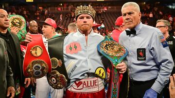 Mexican boxer Saul "Canelo" Alvarez poses with his belts and crown after defeating Kazakh boxer Gennady Golovkin to retain his undisputed super-middleweight crown at T-Mobile Arena in Las Vegas, Nevada, September 17, 2022. (Photo by Frederic J. BROWN / AFP)