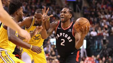 Nov 29, 2018; Toronto, Ontario, CAN; Toronto Raptors forward Kawhi Leonard (2) tries to get past Golden State Warriors forward Kevin Durant (35) on his way to the basket in the third quarter at Scotiabank Arena. The Raptors beat the Warriors 131-128 in overtime. Mandatory Credit: Tom Szczerbowski-USA TODAY Sports
