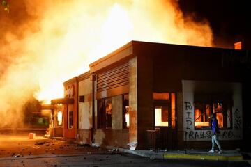 A Wendy’s burns following a rally against racial inequality and the police shooting death of Rayshard Brooks, in Atlanta, Georgia.