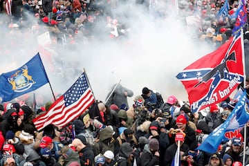 Tear gas is released into a crowd of protesters during clashes with Capitol police at a rally to contest the certification of the 2020 US presidential election results by the US Congress, at the Capitol Building in Washington, January 6, 2021. 