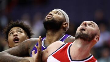 WASHINGTON, DC - NOVEMBER 28: Kelly Oubre Jr. #12 (L) and Marcin Gortat #13 of the Washington Wizards (R) go up for rebound against DeMarcus Cousins #15 of the Sacramento Kings (C) at Verizon Center on November 28, 2016 in Washington, DC. NOTE TO USER: User expressly acknowledges and agrees that, by downloading and or using this photograph, User is consenting to the terms and conditions of the Getty Images License Agreement. Rob Carr/Getty Images/AFP
== FOR NEWSPAPERS, INTERNET, TELCOS & TELEVISION USE ONLY ==
