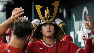 ARLINGTON, TEXAS - AUGUST 16: Shohei Ohtani #17 of the Los Angeles Angels is congratulated in his dugout after hitting a solo home run during the first inning against the Texas Rangers at Globe Life Field on August 16, 2023 in Arlington, Texas. Sam Hodde/Getty Images/AFP (Photo by Sam Hodde / GETTY IMAGES NORTH AMERICA / Getty Images via AFP)