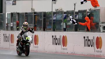 Moto 2 rider Dominique Aegerter of Switzerland celebrates as he crosses the finish line to win the San Marino Motorcycle Grand Prix at the Misano circuit in Misano Adriatico, Italy, Sunday, Sept. 10, 2017. (AP Photo/Antonio Calanni)