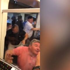 Liverpool and Manchester City fans fight on London tube