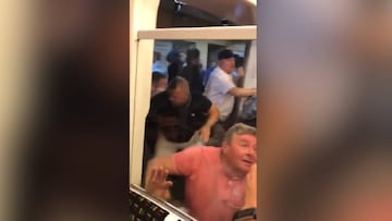 Liverpool and Manchester City fans fight on London tube