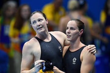 Cate (L) and Bronte Campbell of Australia react after the women's 100m Freestyle final race of the Rio 2016 Olympic Games Swimming events at Olympic Aquatics Stadium