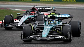 Aston Martin's Spanish driver Fernando Alonso (R) drives during the first practice session ahead of the Formula One Chinese Grand Prix at the Shanghai International Circuit in Shanghai on April 19, 2024. (Photo by Greg Baker / AFP)