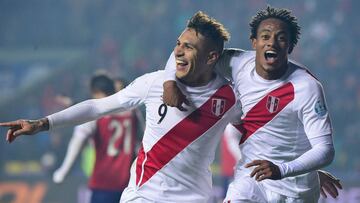(FILES) This file photo taken on July 03, 2015 shows Peru&#039;s forward Paolo Guerrero (L) celebratING with teammate Andre Carrillo after scoring against Paraguay during the Copa America third place football match in Concepcion, Chile on July 3, 2015. 
 