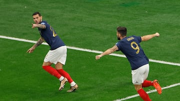 France's defender #22 Theo Hernandez (L) celebrates scoring his team's first goal with France's forward #09 Olivier Giroud during the Qatar 2022 World Cup semi-final football match between France and Morocco at the Al-Bayt Stadium in Al Khor, north of Doha on December 14, 2022. (Photo by Odd ANDERSEN / AFP)