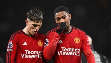 Manchester United's French striker #09 Anthony Martial (R) and Manchester United's Argentinian midfielder #17 Alejandro Garnacho (L) talk as they leave at half-time in the English Premier League football match between Manchester United and Bournemouth at Old Trafford in Manchester, north west England, on December 9, 2023. (Photo by Oli SCARFF / AFP) / RESTRICTED TO EDITORIAL USE. No use with unauthorized audio, video, data, fixture lists, club/league logos or 'live' services. Online in-match use limited to 120 images. An additional 40 images may be used in extra time. No video emulation. Social media in-match use limited to 120 images. An additional 40 images may be used in extra time. No use in betting publications, games or single club/league/player publications. /