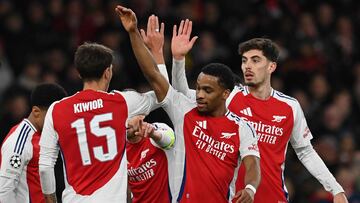 Arsenal's German midfielder #29 Kai Havertz (R) celebrates scoring the team's third goal during the UEFA Champions League football match between Arsenal and Monaco at the Emirates Stadium in north London, on December 11, 2024. (Photo by Glyn KIRK / AFP)