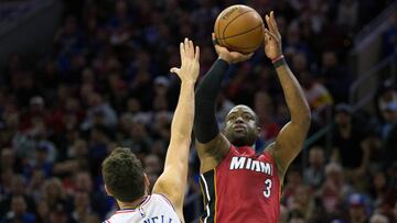 Apr 16, 2018; Philadelphia, PA, USA; Miami Heat guard Dwyane Wade (3) shoots over Philadelphia 76ers guard Marco Belinelli (18) during the second quarter in game two of the first round of the 2018 NBA Playoffs at Wells Fargo Center. Mandatory Credit: Bill